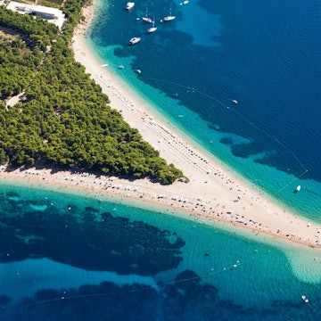 Aerial photograph of the beach, which comes out in a spit of land from the peninsula.