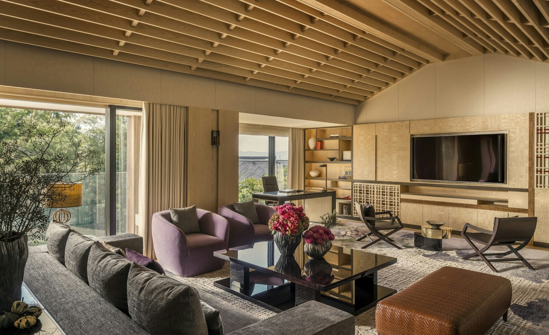 The living area of the Four Seasons Kyoto presidential suite, with Japanese-influence design and views over Japanese rooftops