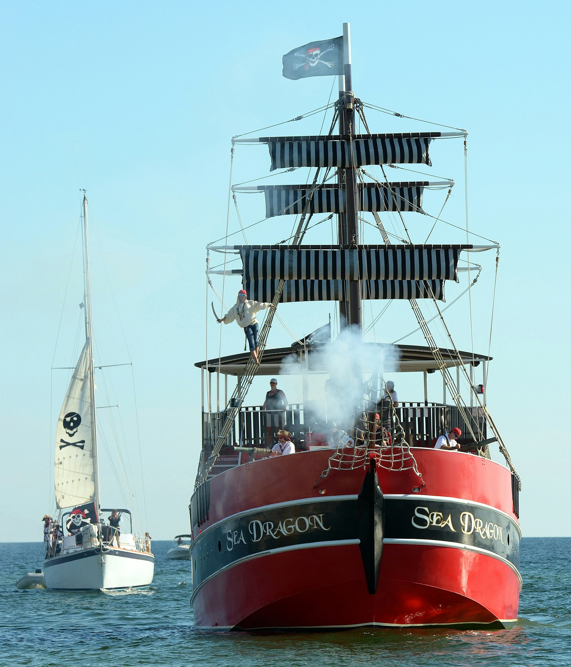 A cannon is fired from a pirate-themed ship in Panama City Beach.