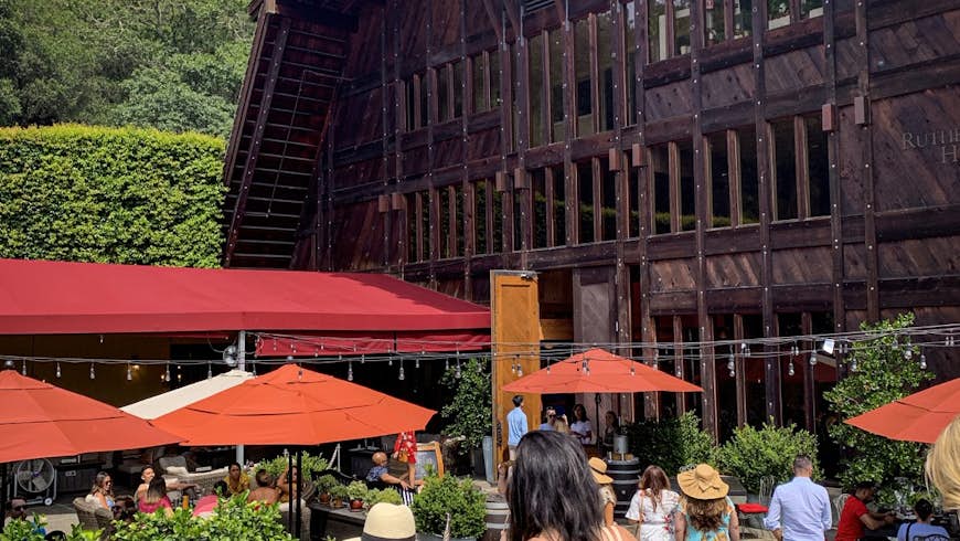 Two women descend stairs toward Rutherford's door; weekend in Napa
