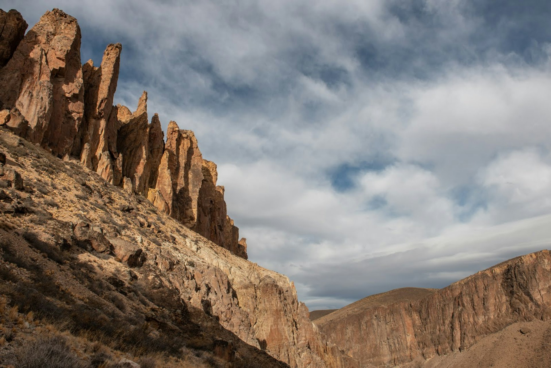 Rock formations under a cloudy sky in Cañadon Pinturas, of Argentina's Patagonia National Park