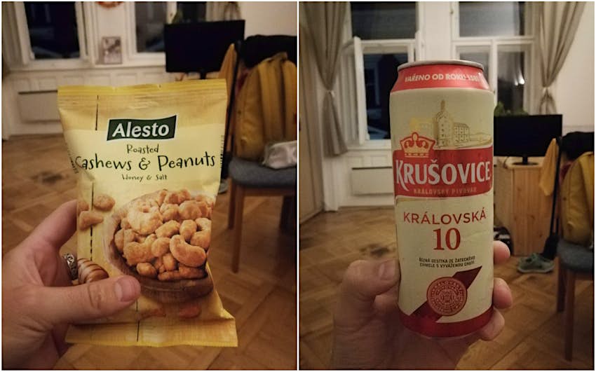 A close up of a packet of roasted cashews and peanuts on the left; a can of Czech beer on the right.