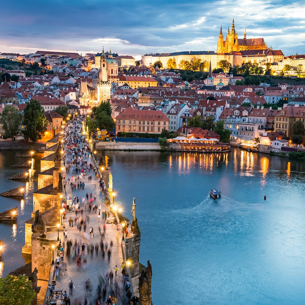 Panorama of Prague with red roofs from above summer day at dusk, Czech Republic