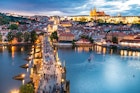 Panorama of Prague with red roofs from above summer day at dusk, Czech Republic