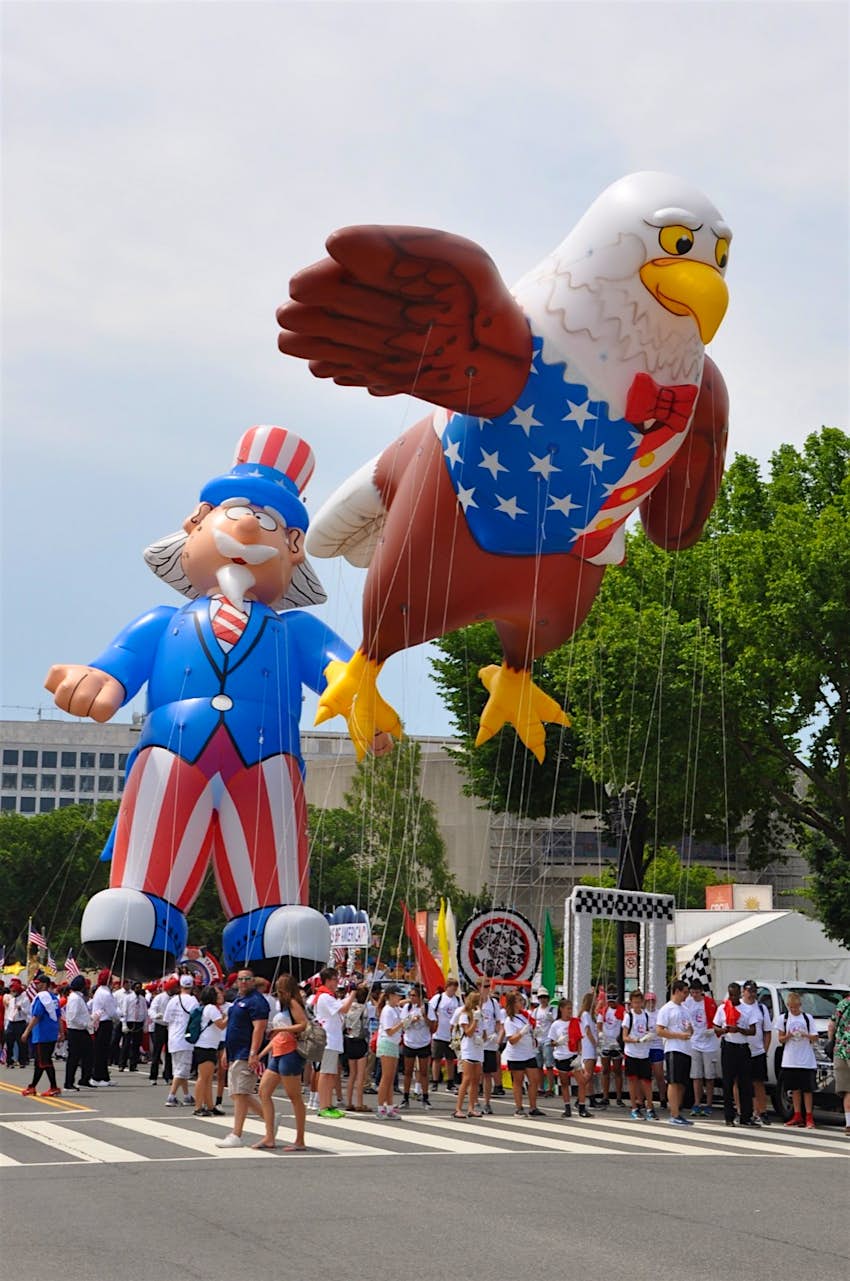 An inflatable bald eagle and Uncle Sam, anchored by dozens of paraders; best fourth of july celebrations