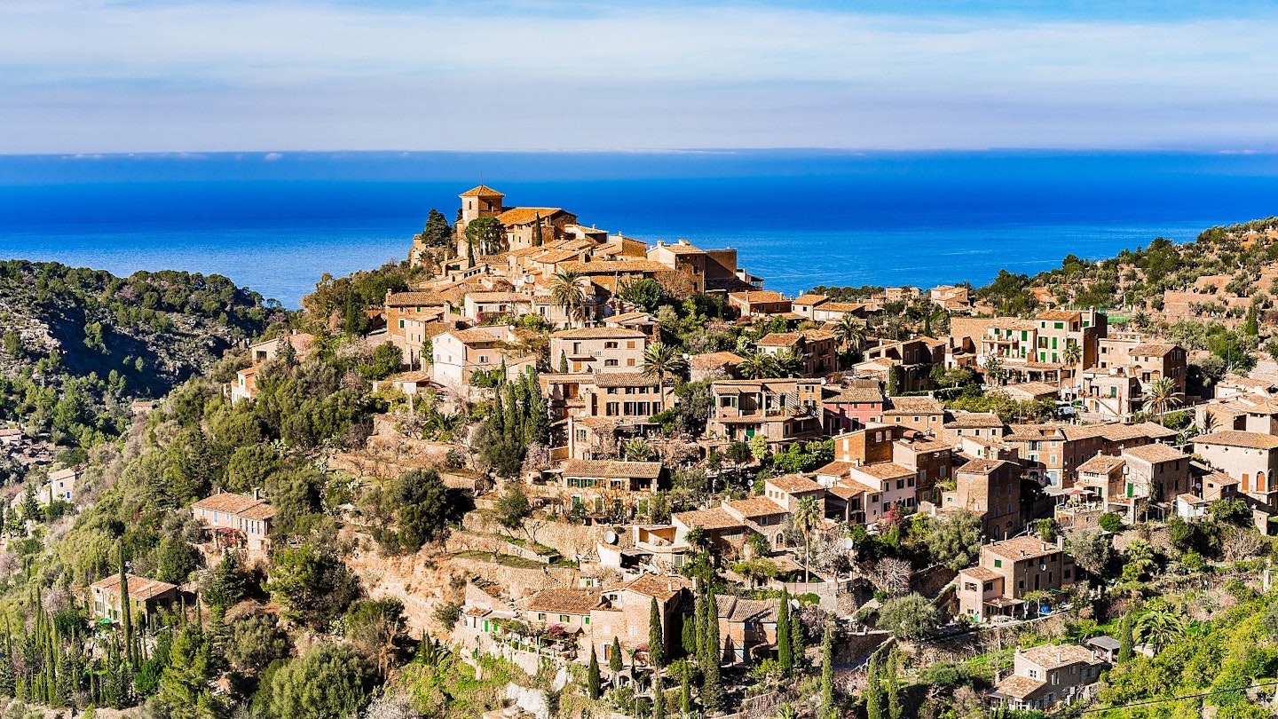 Looking over Deià's honey-coloured houses, which occupy a stunning mountain-top location overlooking the Mediterranean.