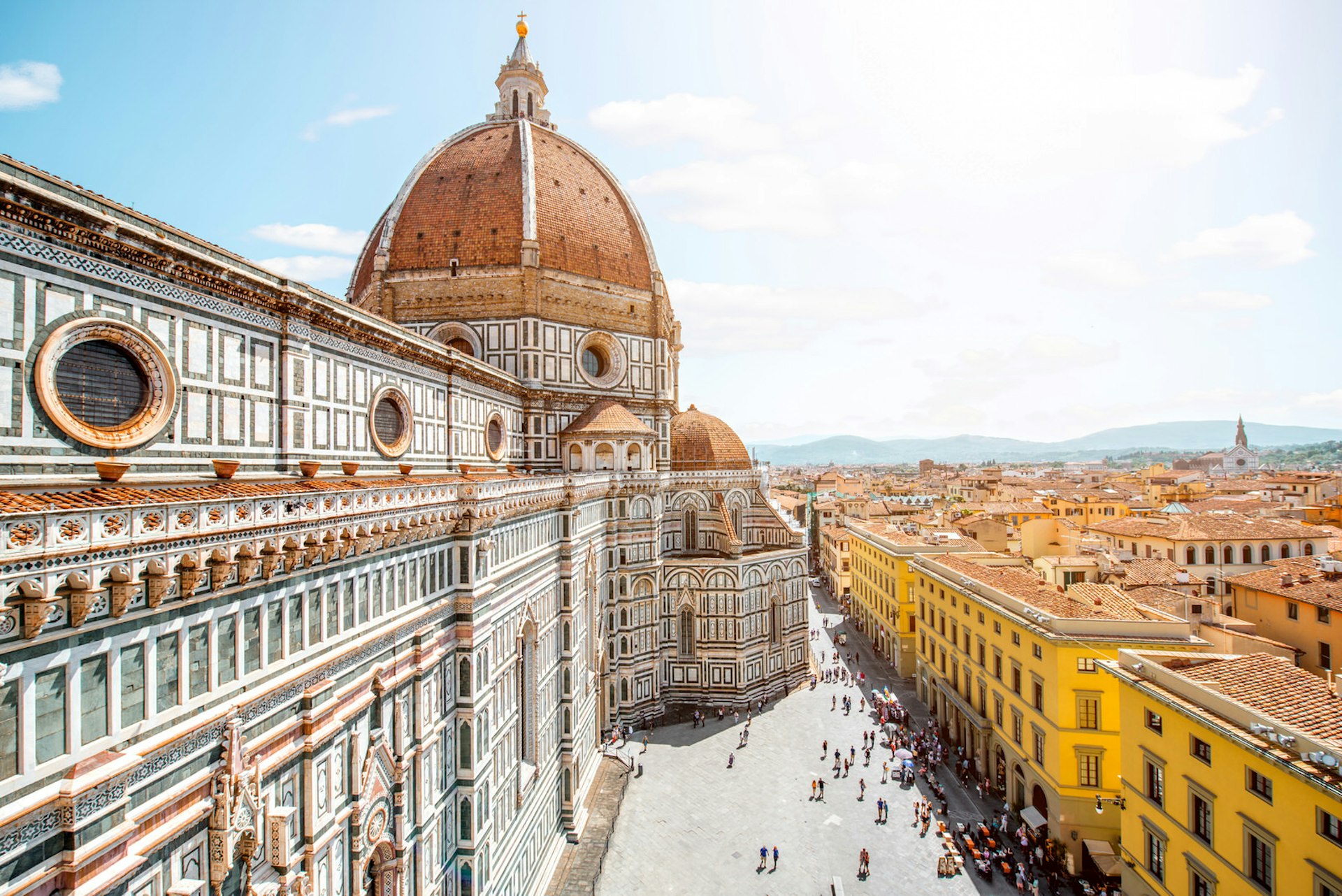 Top cityscape view on the dome of Santa Maria del Fiore church and old town in Florence; the wide streets are perfect for strollers and travel with your baby