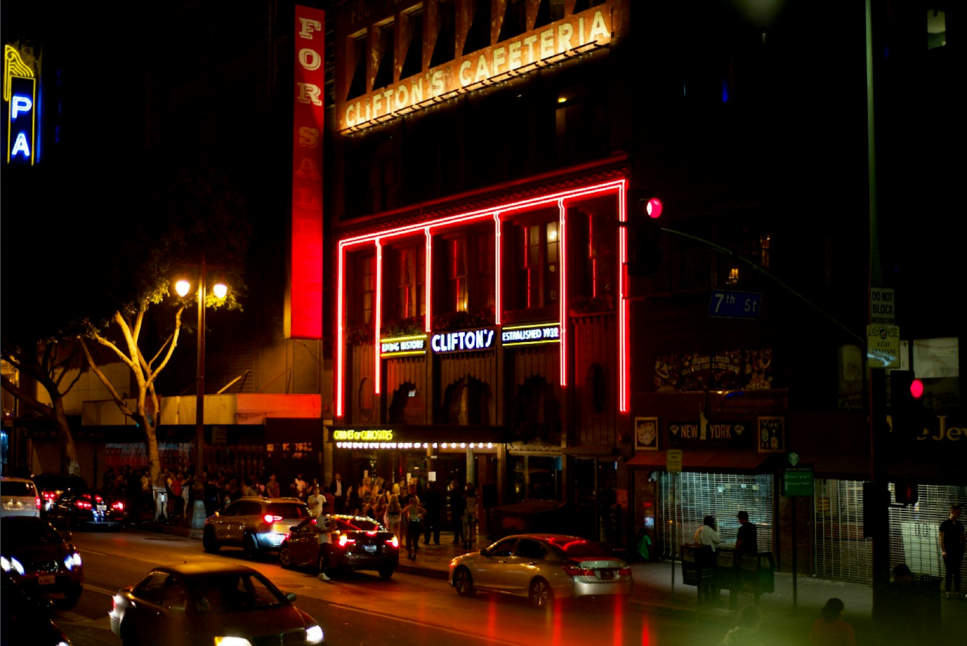 The facade of Clifton's Cafeteria, a multi-story Los Angeles landmark, is covered in neon lights; Los Angeles neon