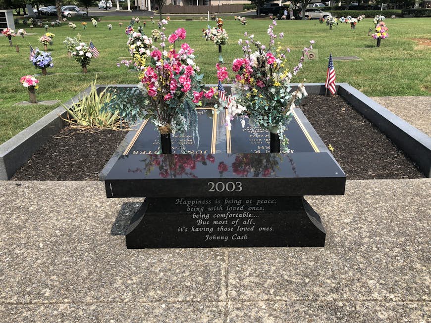 Gravesites of Johnny and June Cash, with memorial bench in front