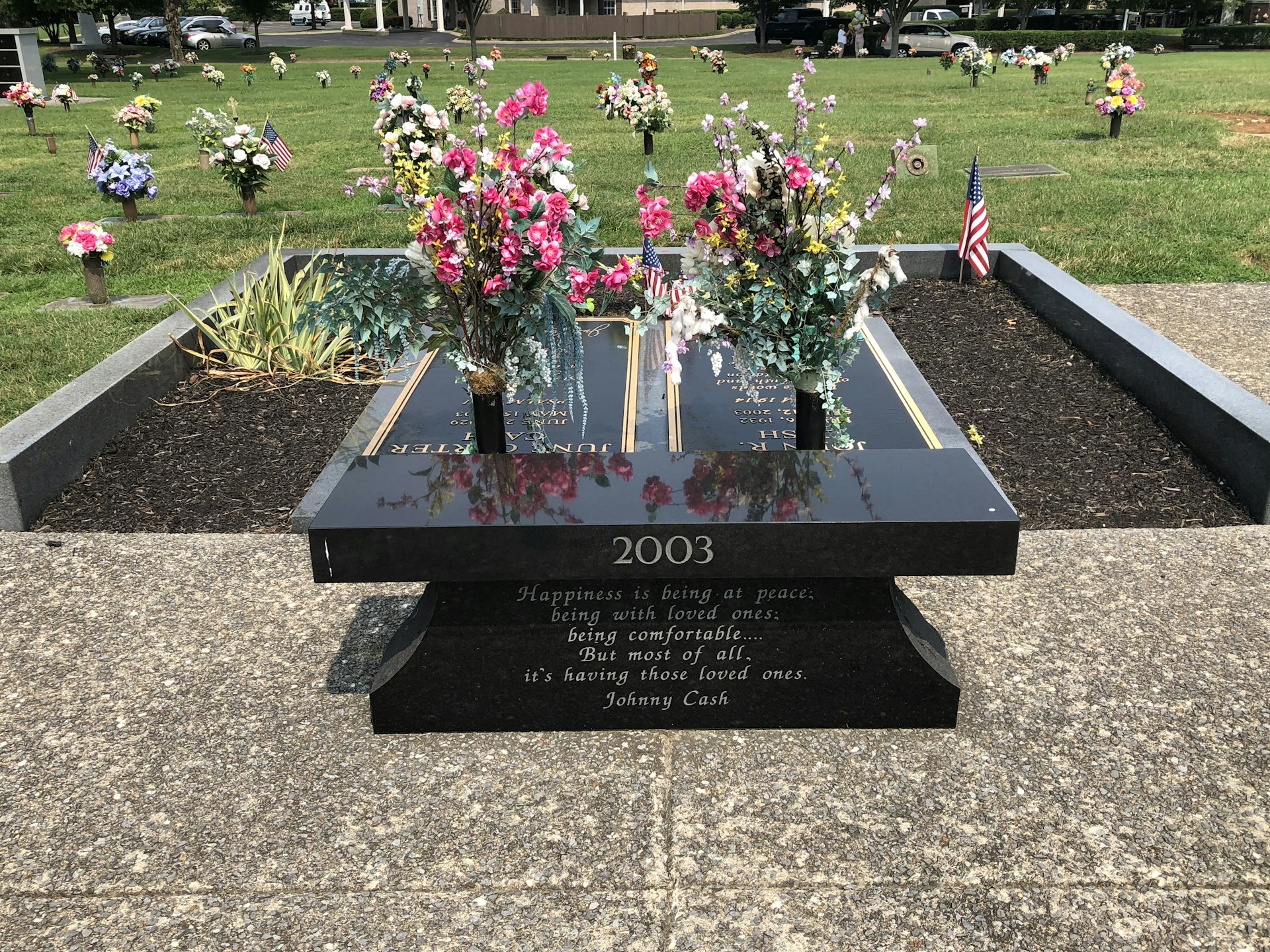 Gravesites of Johnny and June Cash, with memorial bench in front