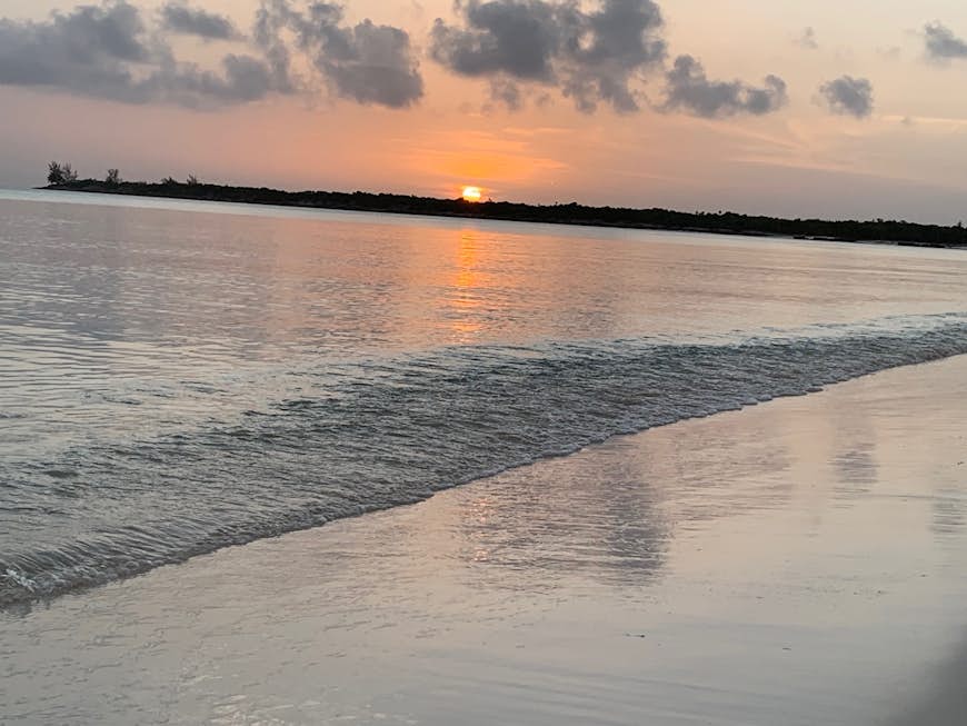 The sun sets on a beach in Long Island, Bahamas 