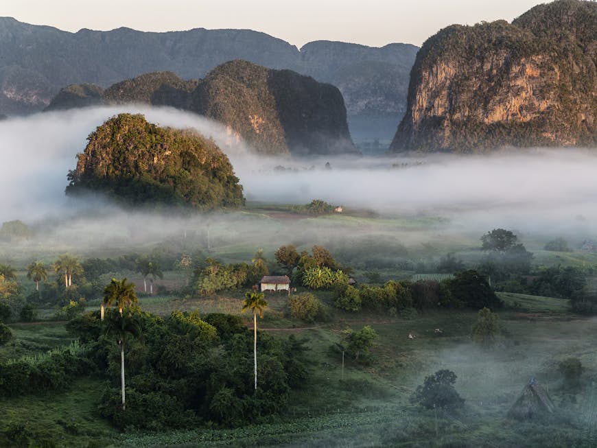 A fog covers a rural valley in Vinales, Pinar del Rio, Cuba