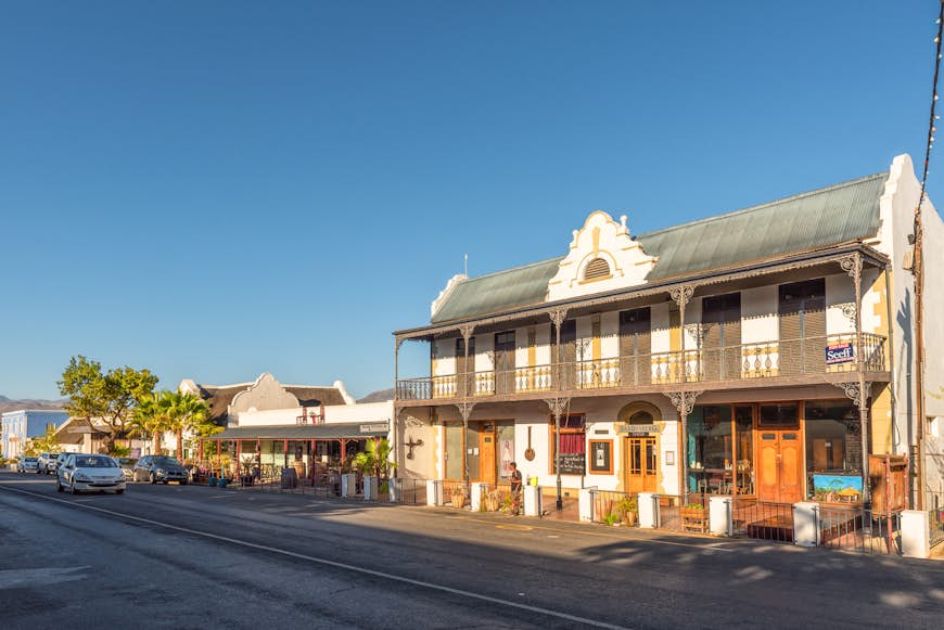 A street lined with historic buildings in Winelands town of Tulbach; the main buildling features covered verandahs on both the ground and first floor