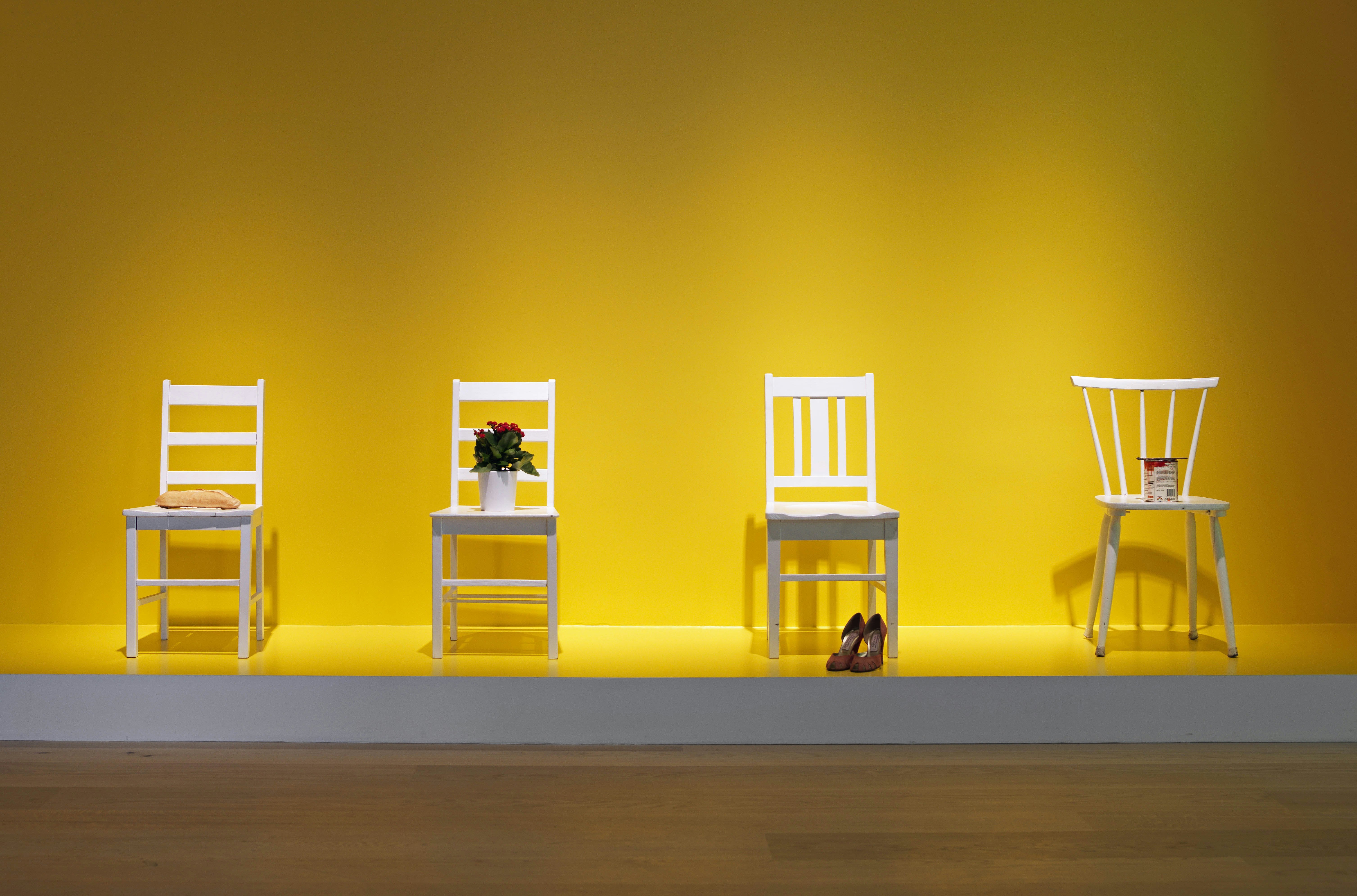 4 white chairs, bread, a pair of shoes, a potted flower, a can with paint and brush.jpg