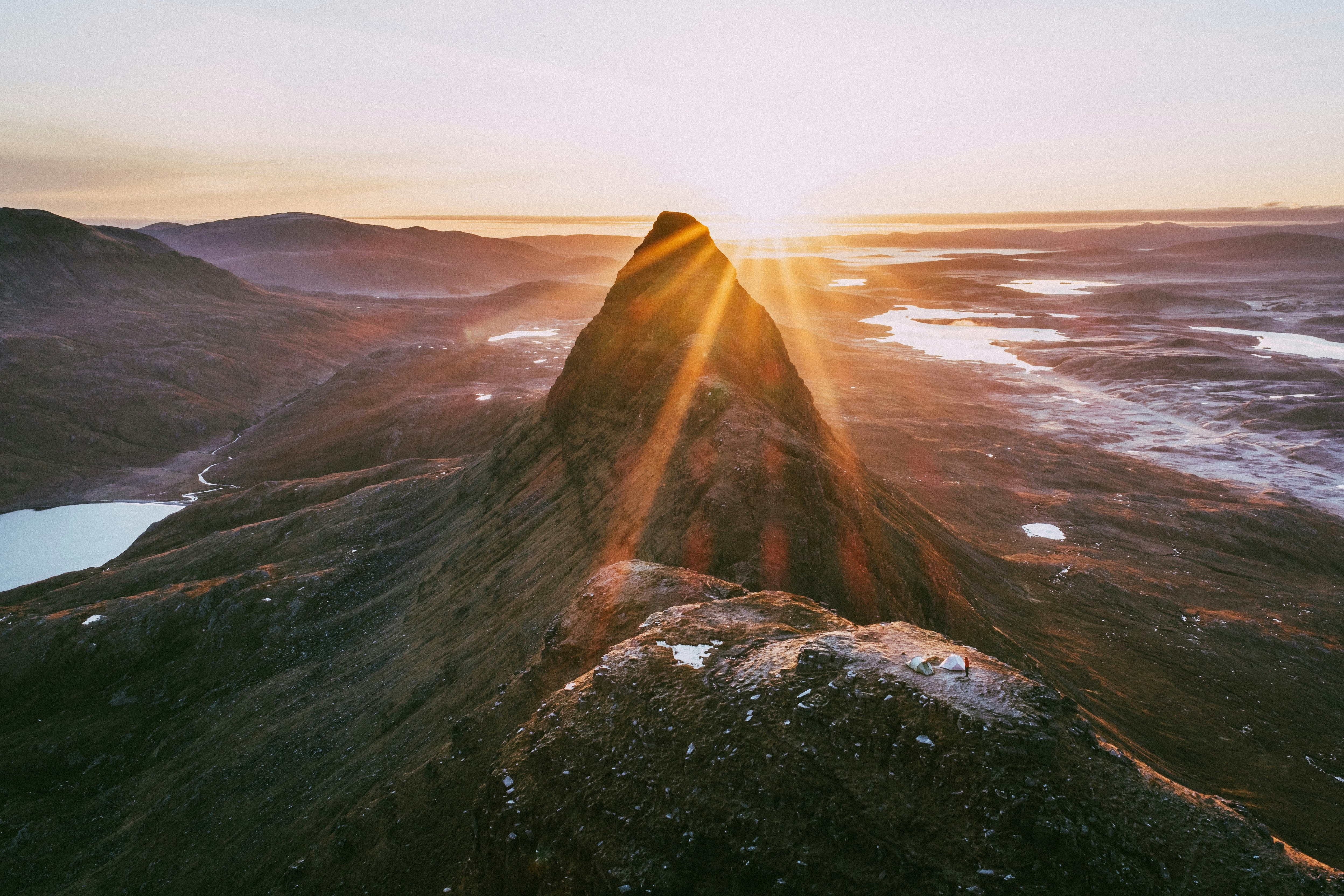 A view over the ridge of Suilven mountain at sunrise.