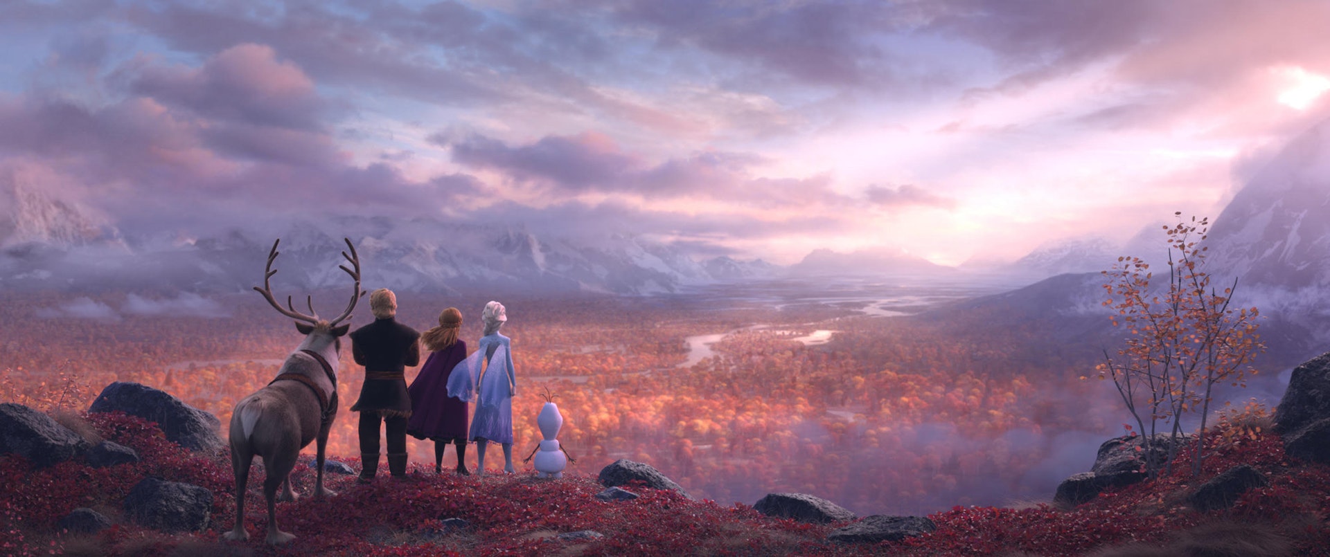 The cast of Frozen 2 overlook a gloomy, autumn forest