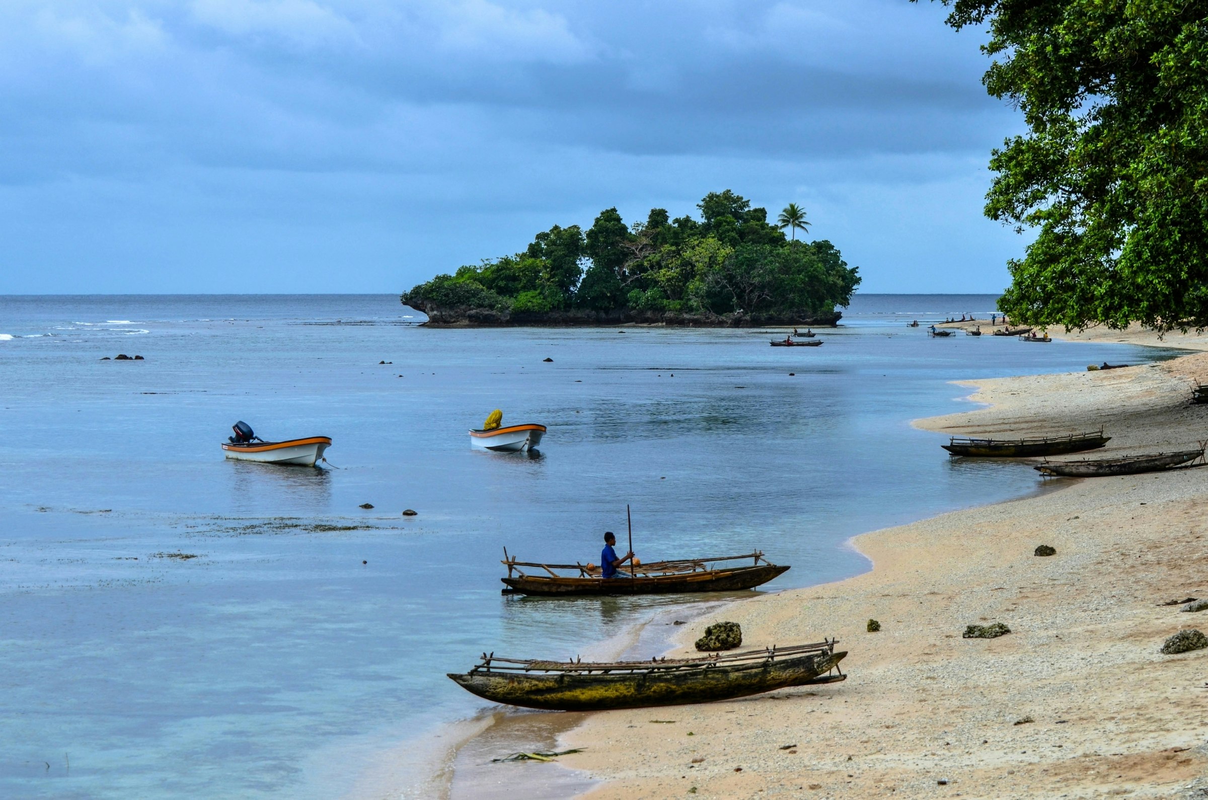 Small fishing boats on a tropical beach.jpg