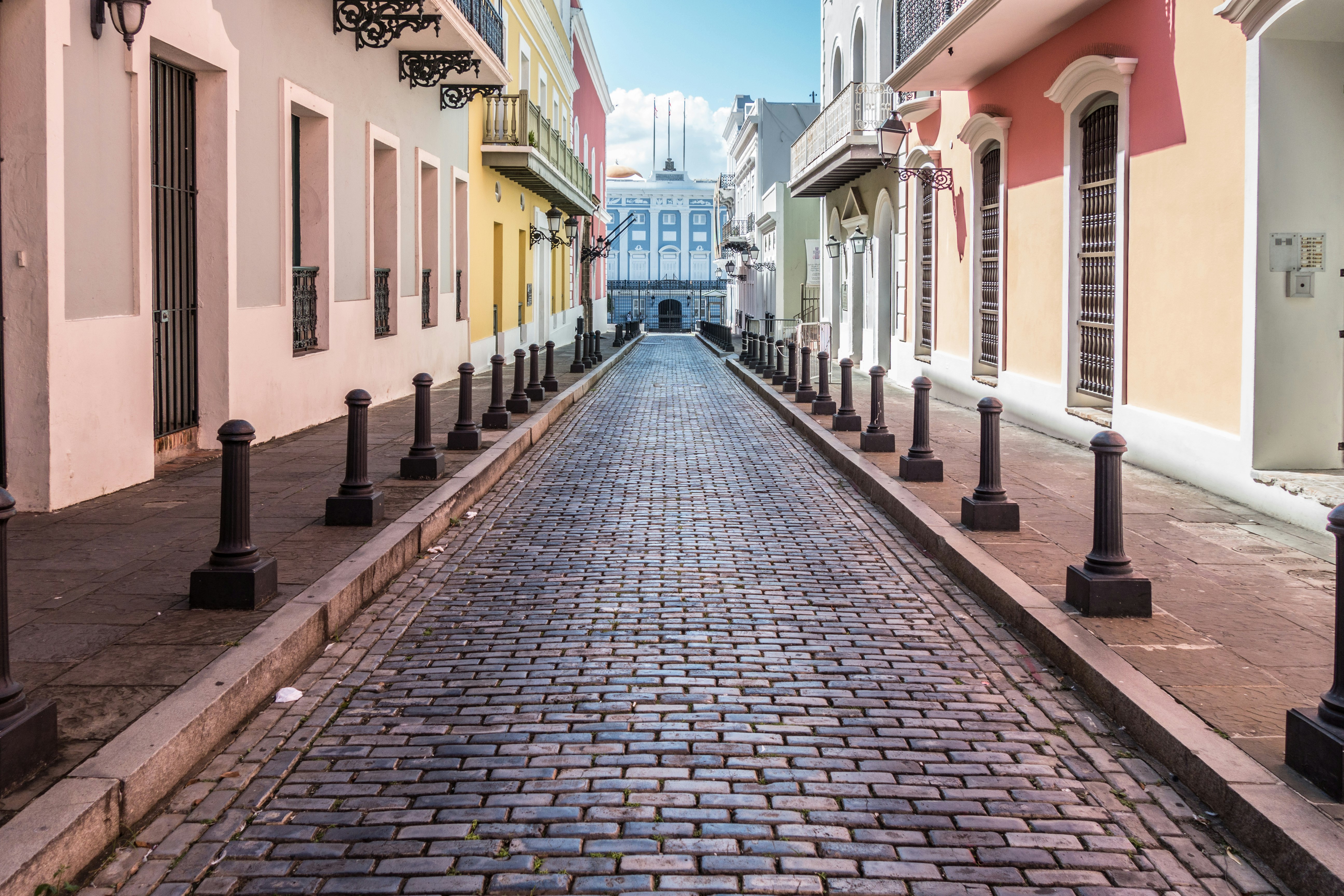 A cobbled street flanked by colorful buildings in Old San Juan town, Puerto Rico