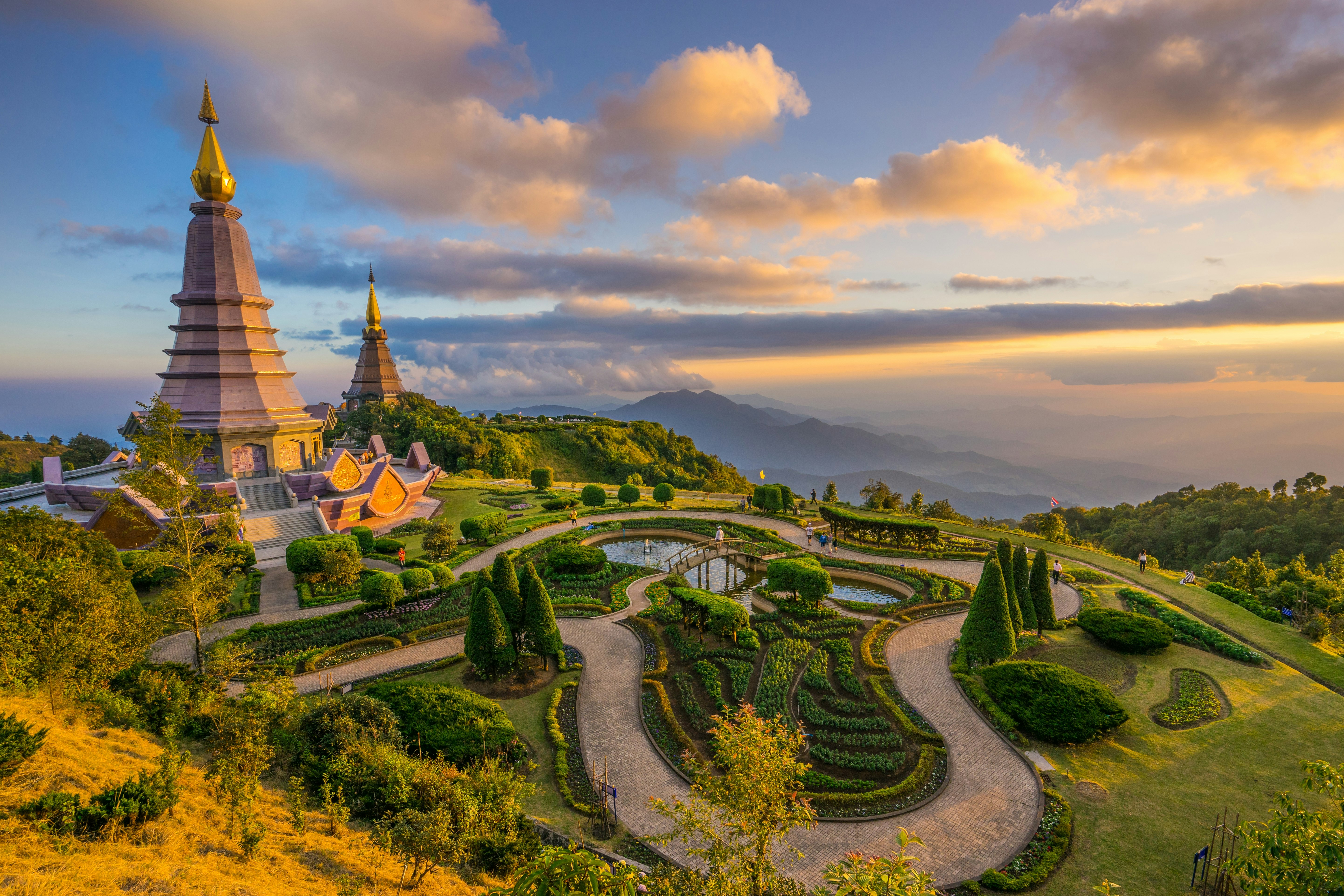 An aerival view of the summit of Doi Inthanon mountain near Chiang Mai, where two pagodas stand in manicured grounds.