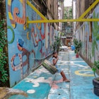 A girl plays on a swing in one of the rennovated back alleys.jpg