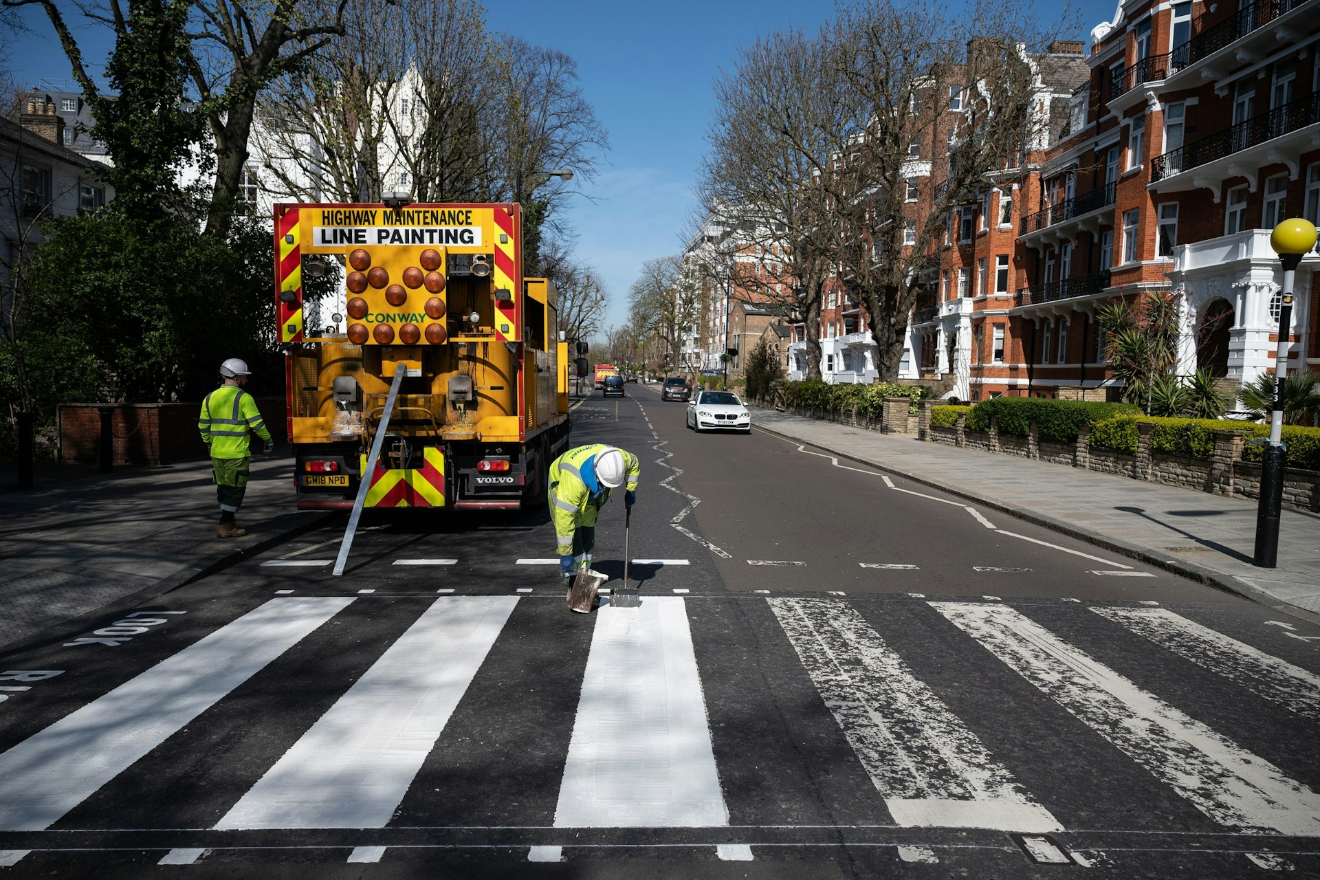 A Highways Maintenance team takes advantage of the COVID-19 coronavirus lockdown to re-paint the iconic Abbey Road crossing.jpg