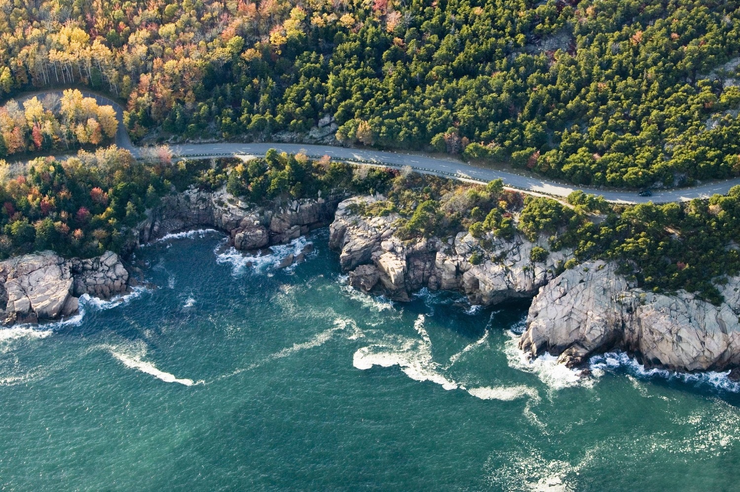 Aerial of the coastline surrounding Acadia National Park in autumn.