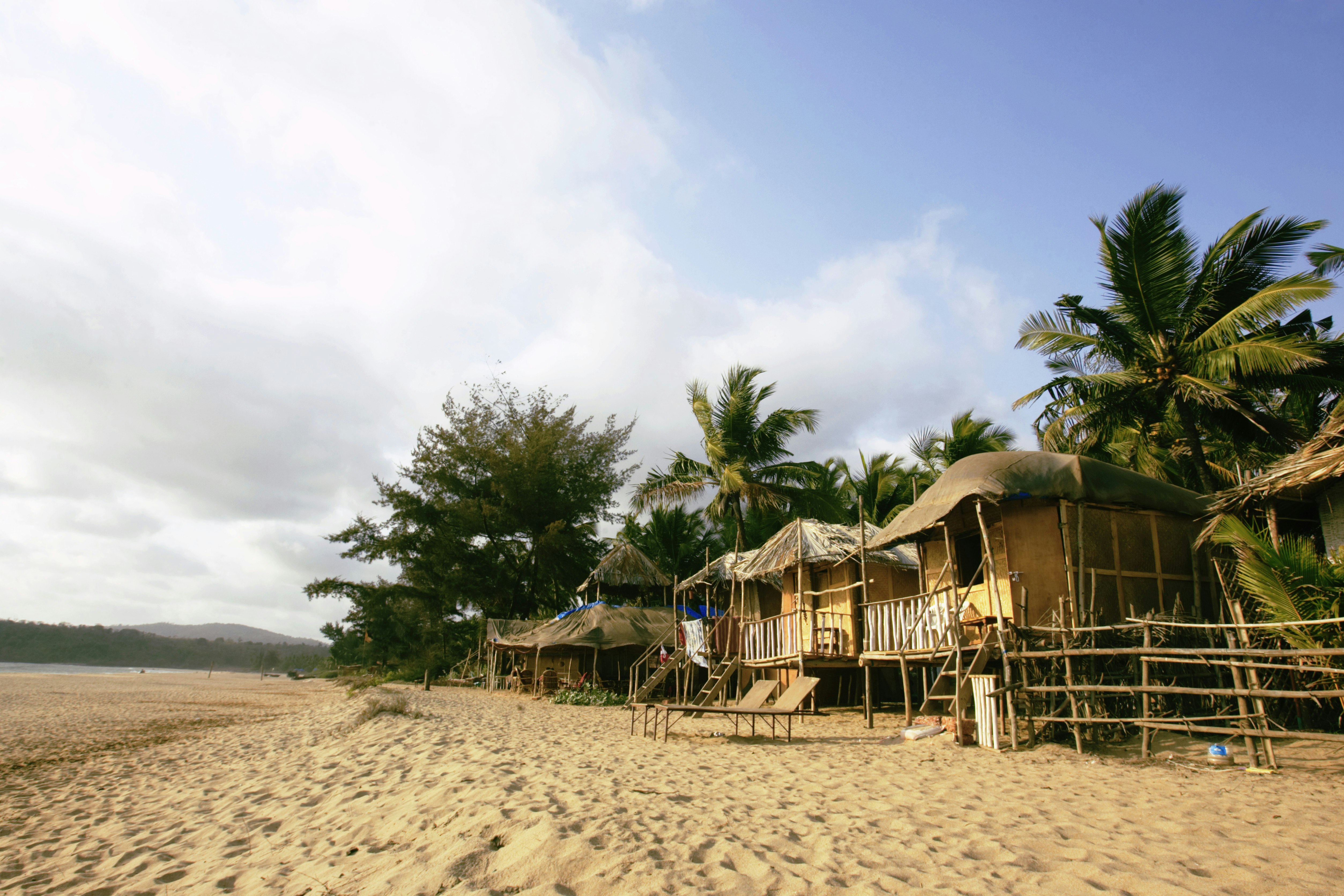 Huts, trees, sand and the beach