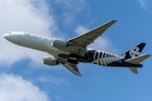 Air New Zealand’s Boeing 777 flying over Auckland City