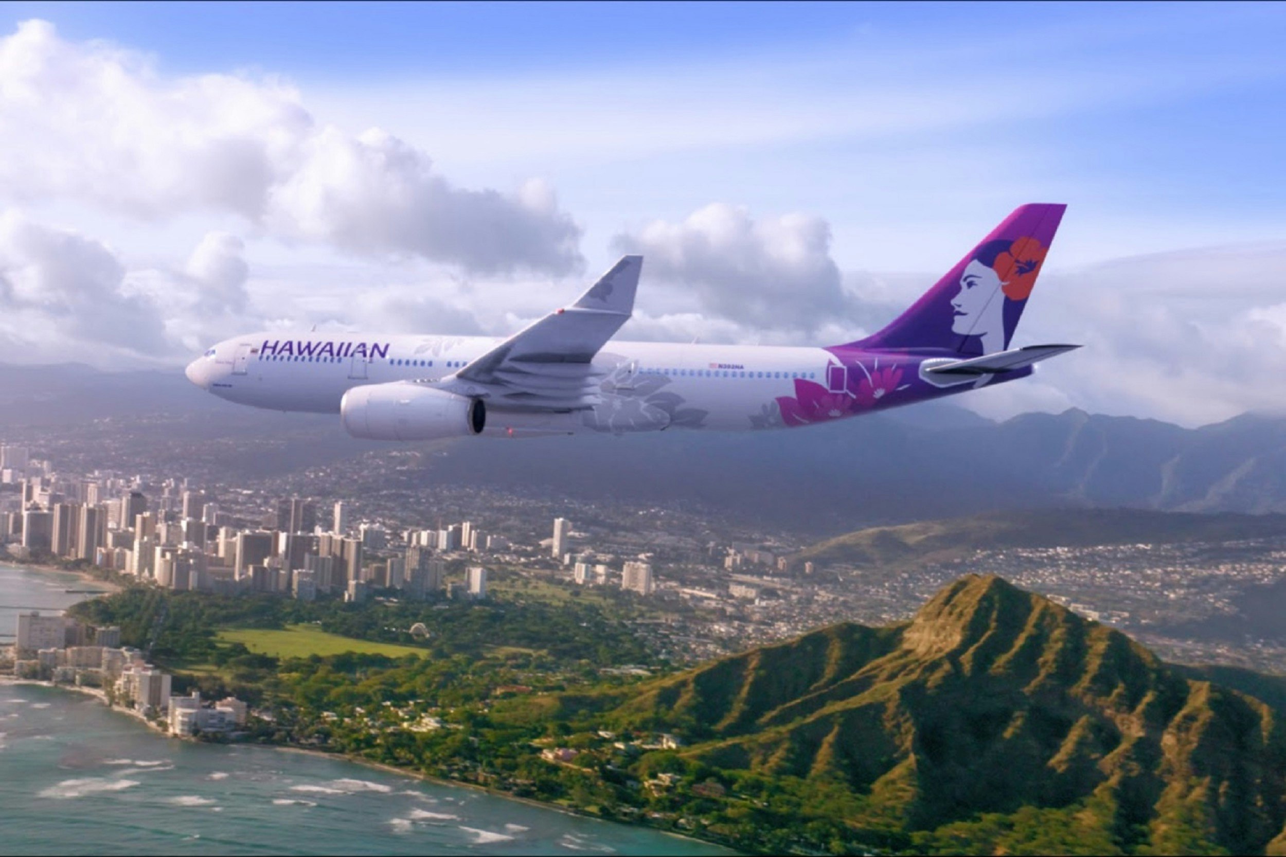 An airplane with a paint job of a native Hawaiian woman flies above the Waikiki area of O'ahu