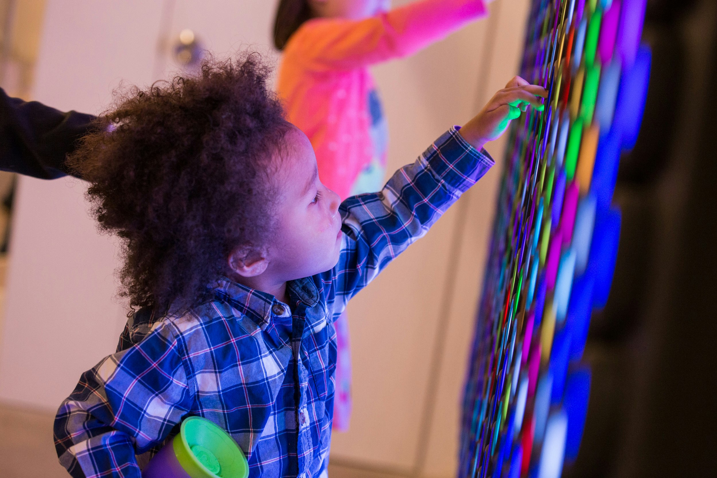 Young child interacts with exhibit.jpg