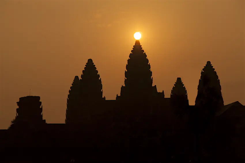 Angkor Wat - spring equinox.jpg The sun rises directly behind a stone temple at Angkor Wat during the spring equinox.