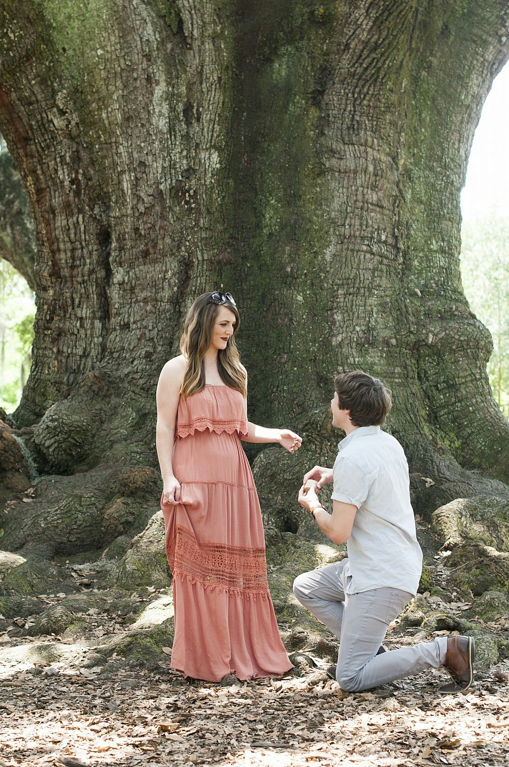 Lonely Planet staffer Dustin is on one knee proposing to his girlfriend Liz next to an enormous old tree in Audubon Park, New Orleans.