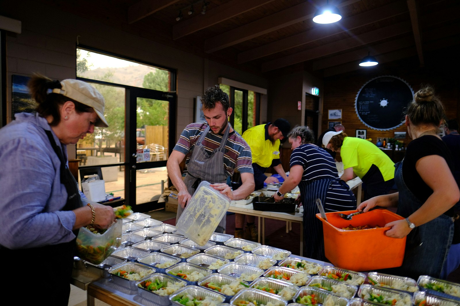 Volunteers pack food parcels for people affected by the bushfires in Australia