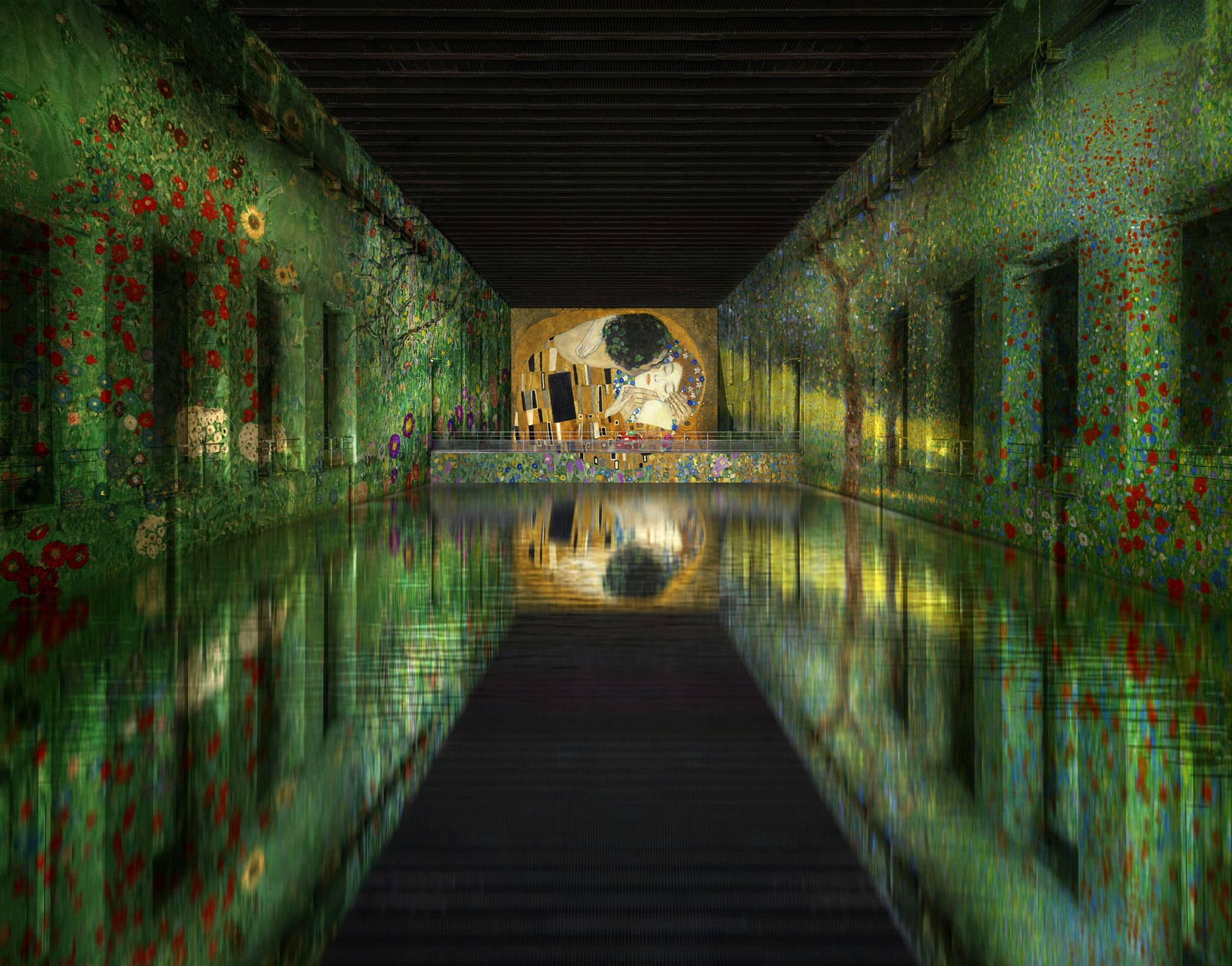 A view of the digital installation of Gustav Klimt's 'Jardin paysan avec fleurs de tournesol' at Les Bassins de Lumières in France.