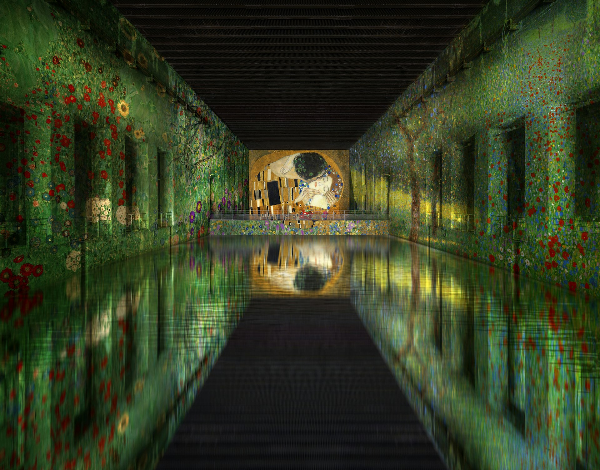 A view of the digital installation of Gustav Klimt's 'Jardin paysan avec fleurs de tournesol' at Les Bassins de Lumières in France.