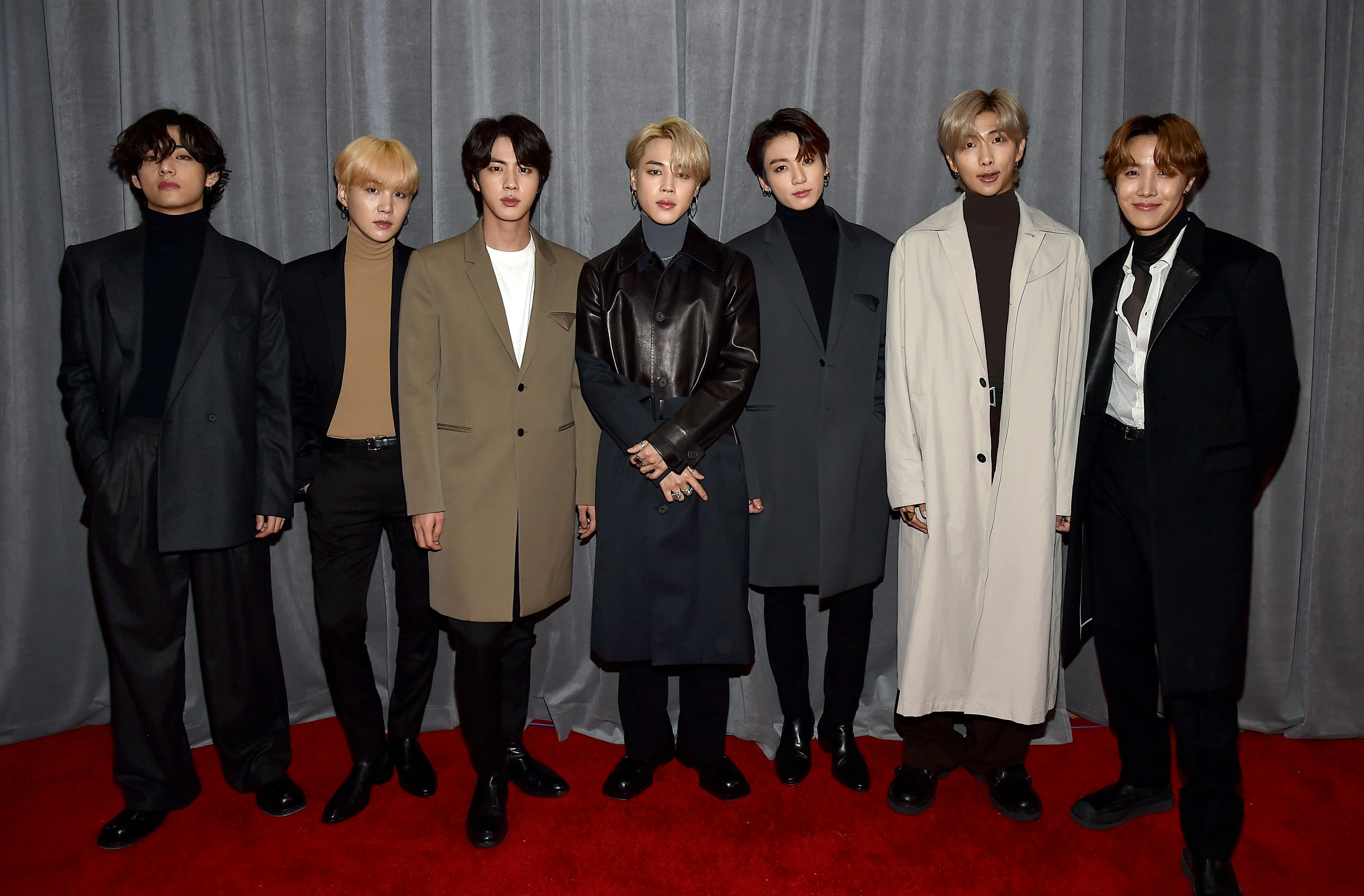 The seven members of K-Pop boyband BTS on the red carpet of the Grammy Awards