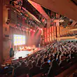 Interior of Barbican Hall in London, decked out in blond wood.