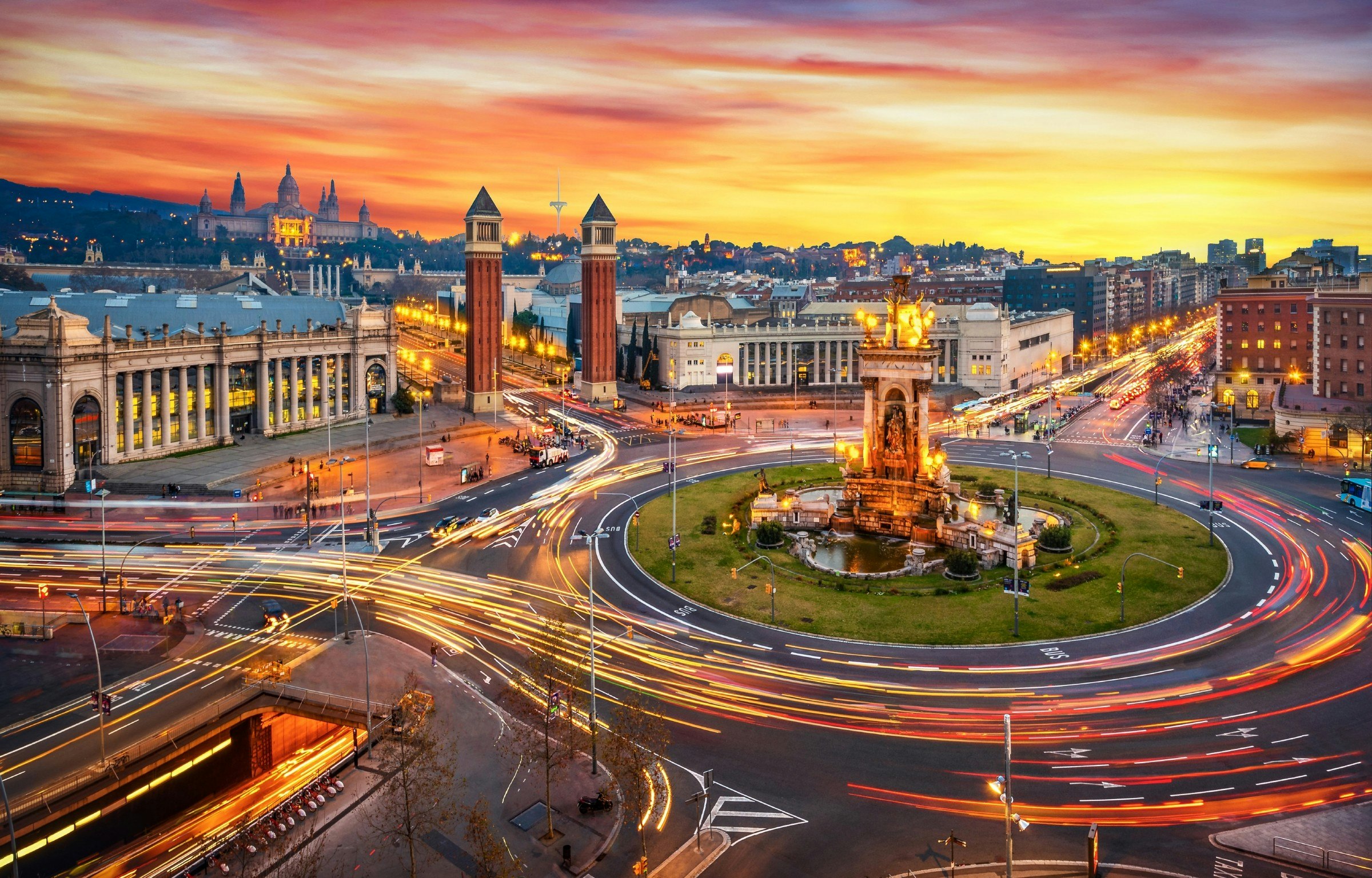 Long exposure of traffic passing the roundabout of Plaça d'Espanya in Barcelona during sunset