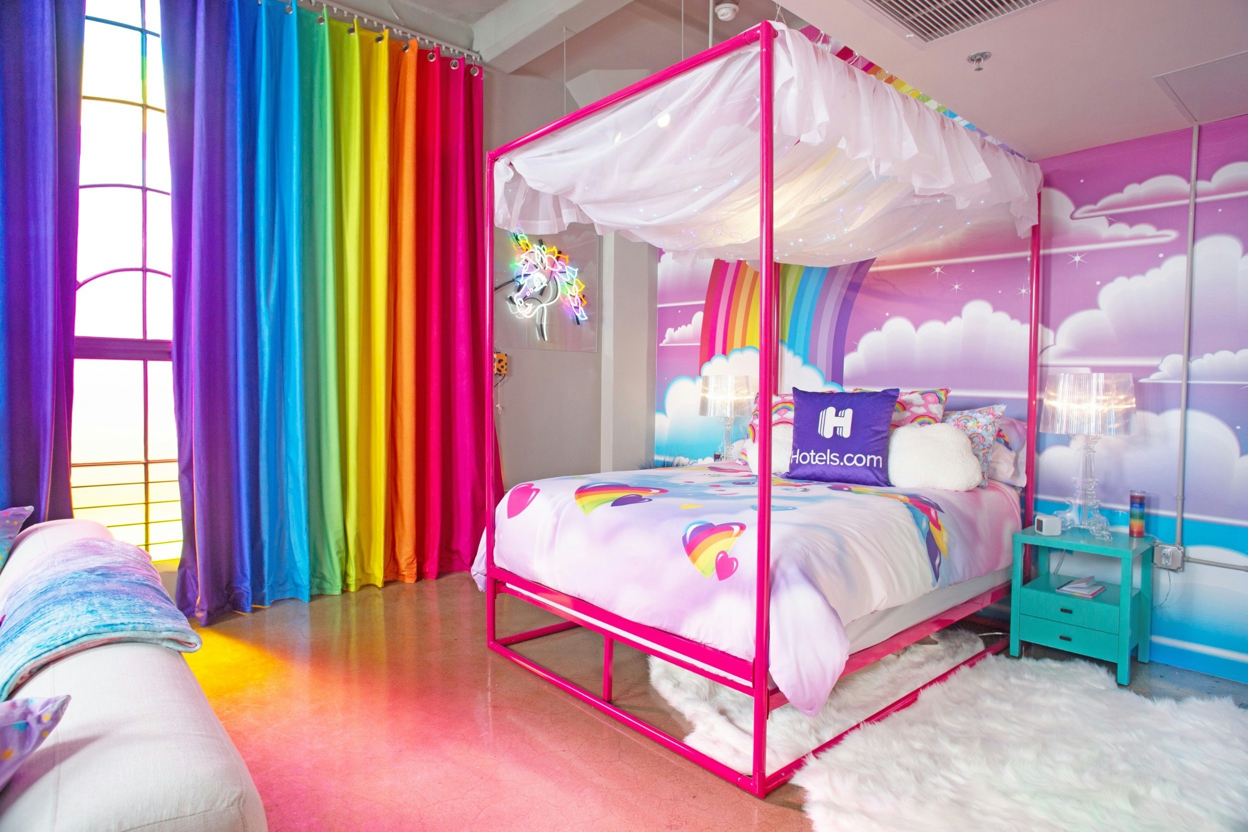 The colourful bedroom at the Lisa Frank Flat, complete with rainbow curtains