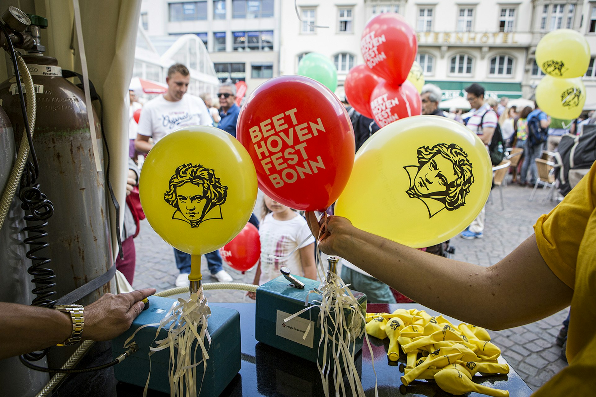 Red and yellow balloons with Beethoven's face printed on the yellow ones