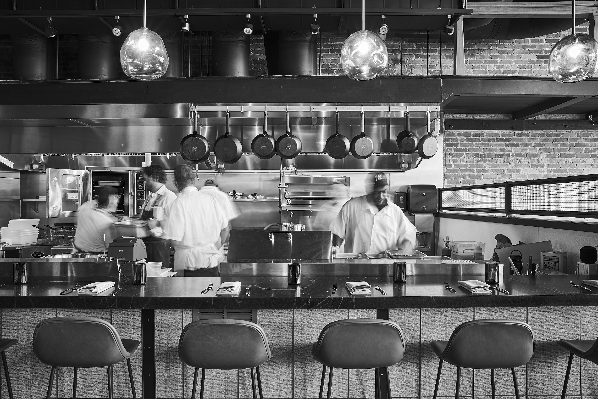 black and white shot of the open kitchen at Benne on Eagle 