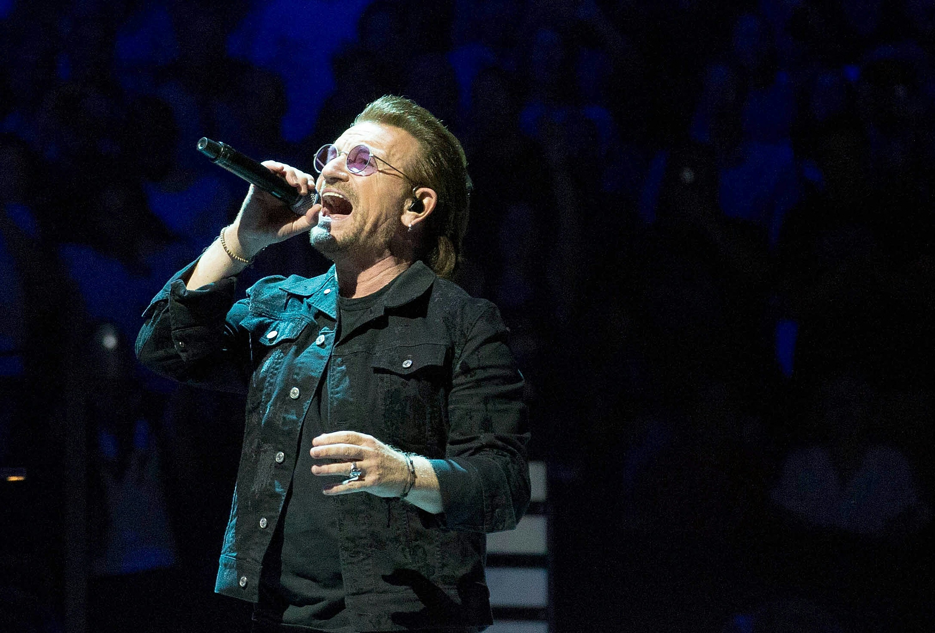 Bono singing on stage