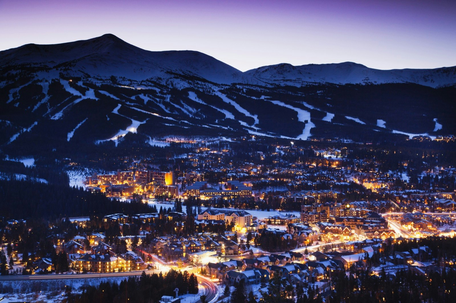 View of Breckenridge, Colorado at the base of a ski mountain lit up at night