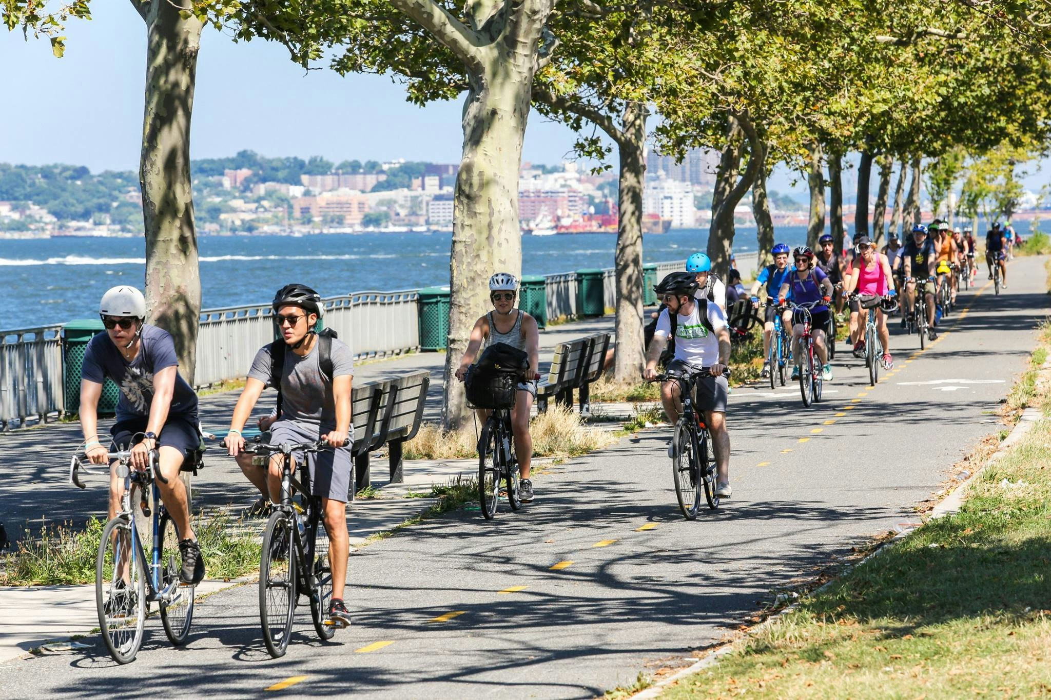 A line of cyclists on the Brooklyn waterfront 