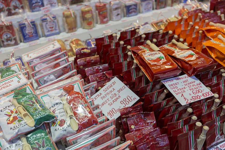 Rows of plastic packages filled with various styles of paprika at a Budapest market place; Budapest autumn