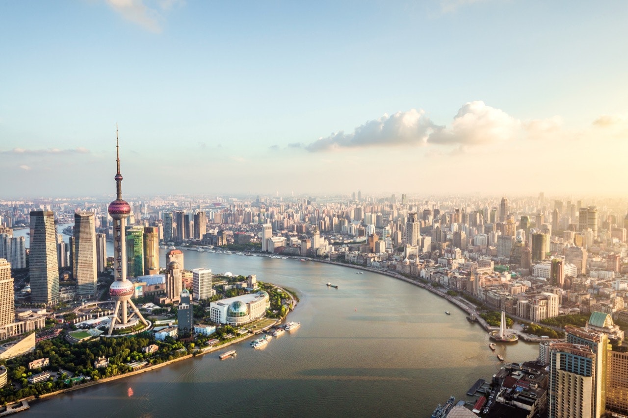 Elevated view of Lujiazui financial district and the Bund skyline at dusk; Shanghai, China. 