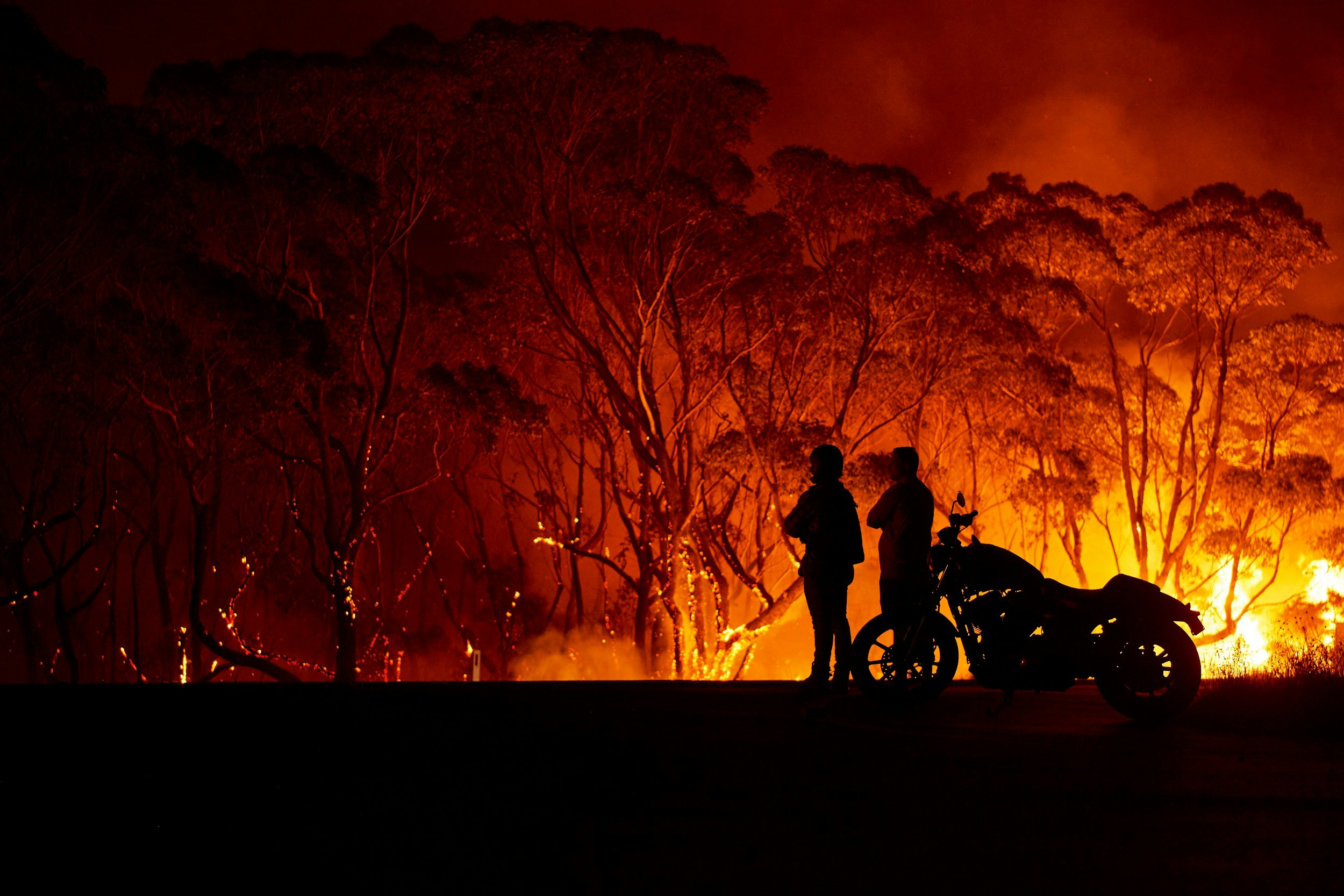 People looking on at the bushfires in Australia