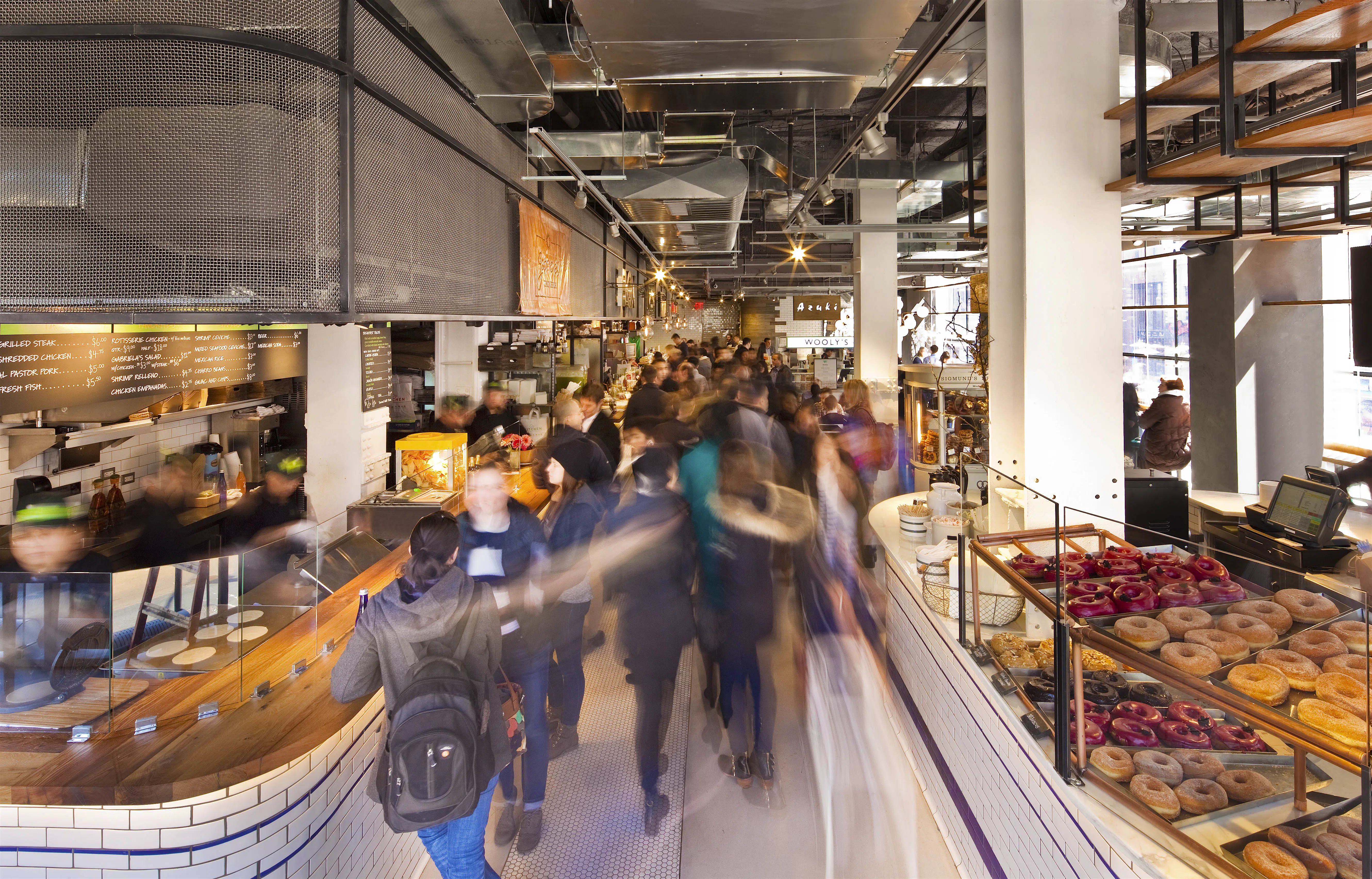 city_kitchen_new_york.jpg Long exposure shot of the interior of City Kitchen food hall. The delicious food on display can be seen clearly, while the patrons are a blur.
