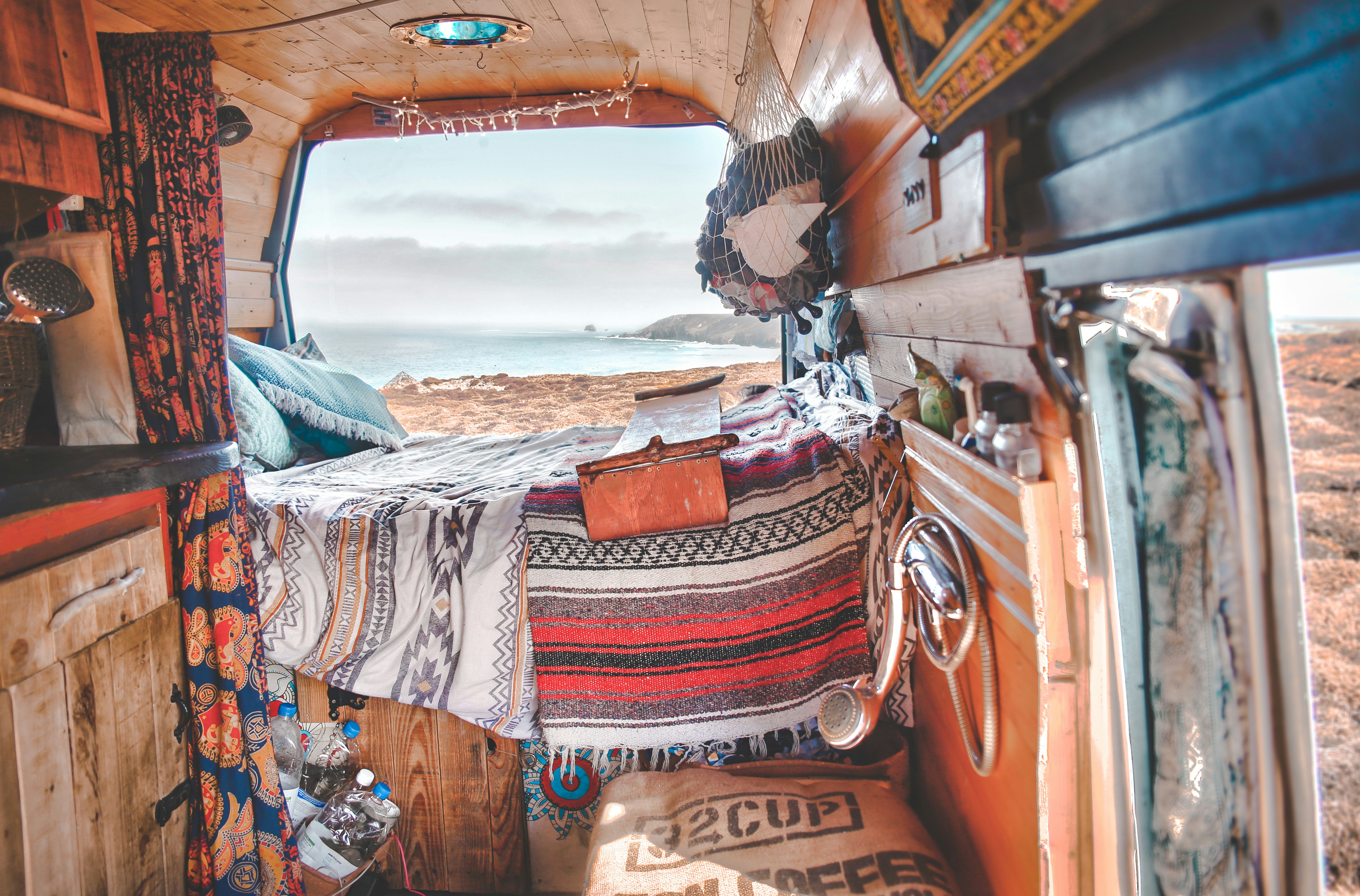 A cosy camper van with a view of the baech