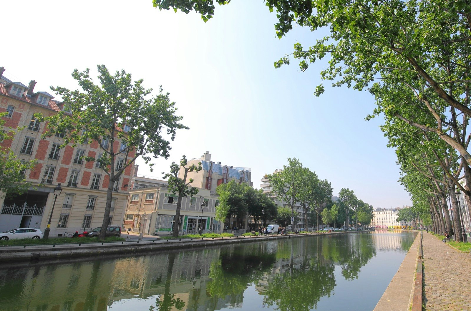 The Canal St-Martin meanders through a Paris neighborhood